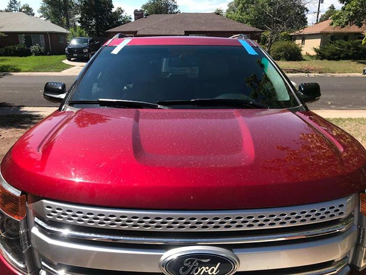 Chihuas Autoglass technician installing windshield in Denver